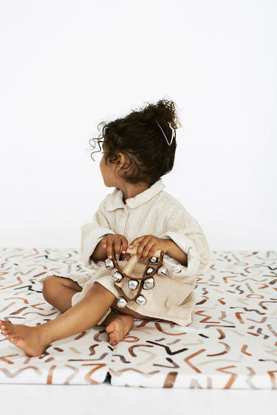 toddler playing on toki mats diversity collection blended play mat