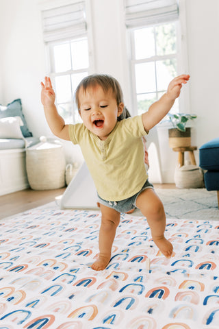 baby walking on a toki mats play mat