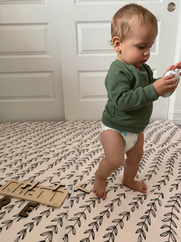 baby walking on a toki mats play mat