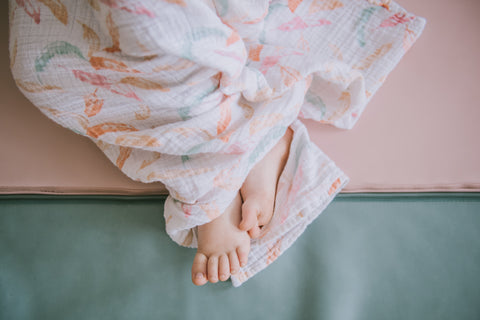 baby's bare feet on a toki mats play mat