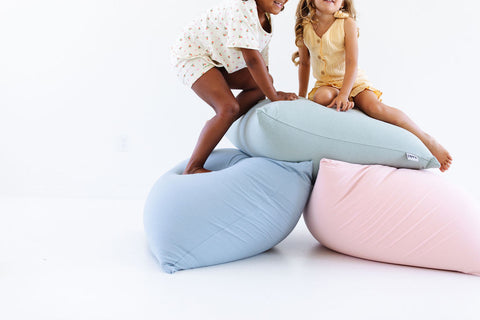 kids sitting on toki mats bean bags