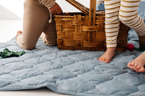 children walking on a toki mats picnic blanket