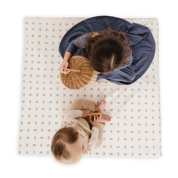 toddlers playing on a toki mats play mat