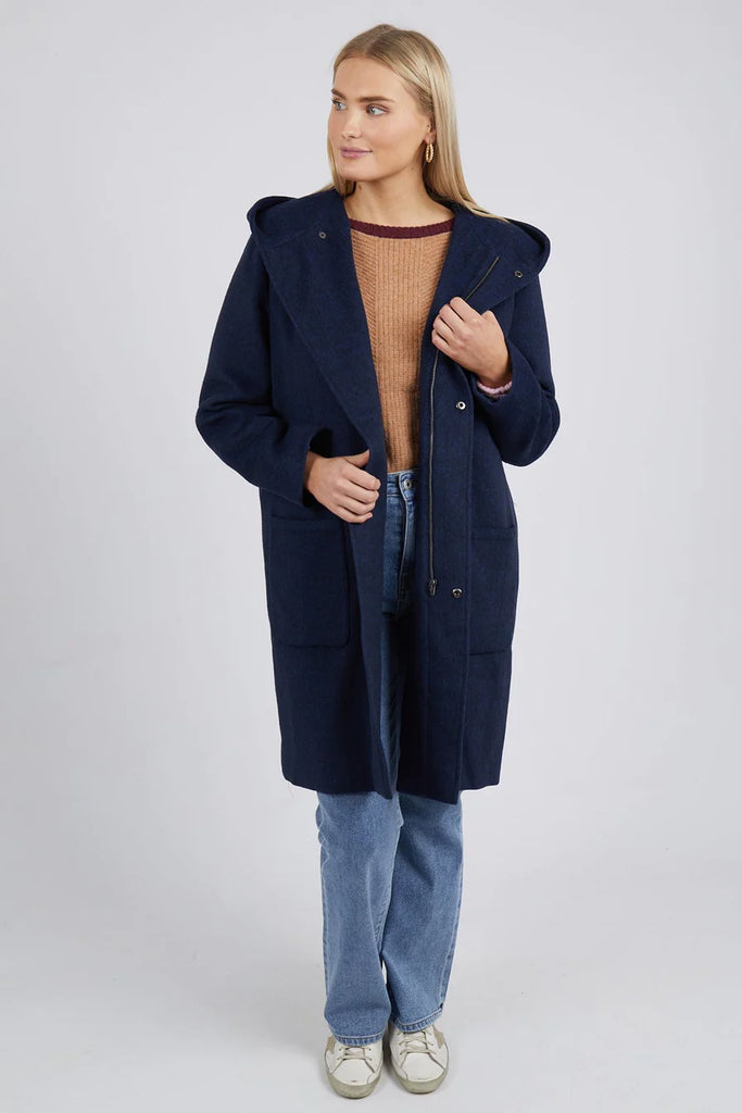 A woman modelling the Jordan Coat by Elm