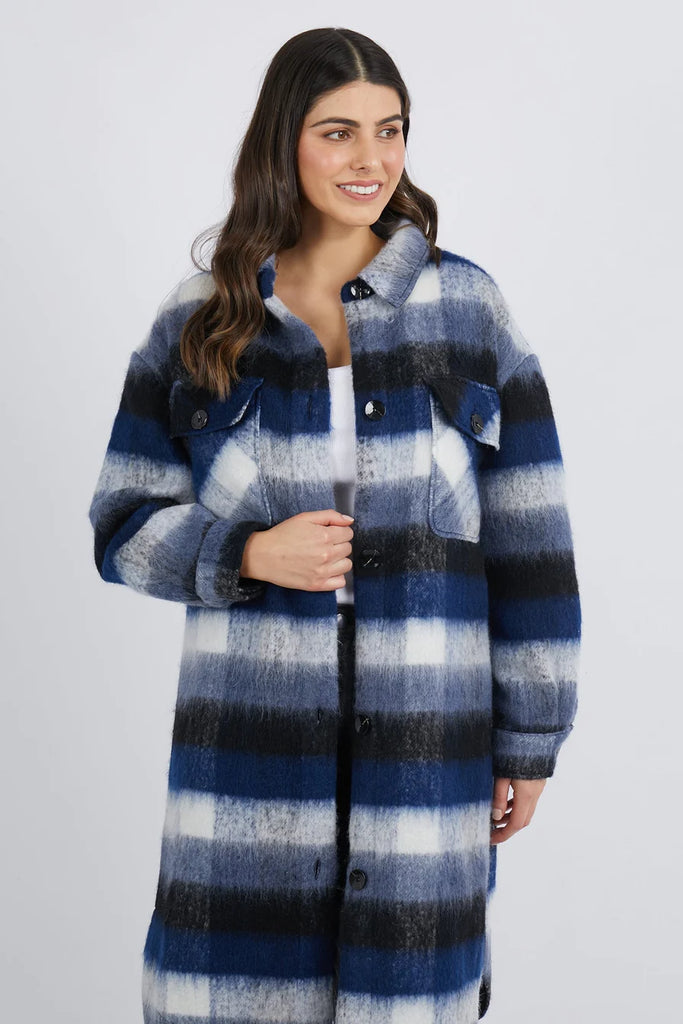 A woman modelling the Foxwood branded Nellie Jacket in Check