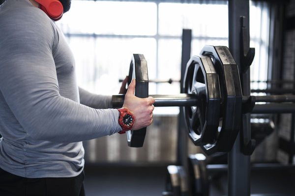 Image of a person lifting weights, representing the transformative journey from zero to hero in muscle growth.