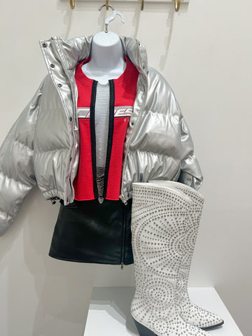 repurposed chiefs tee with a chain down the middle, metallic puffer jacket and white boots with silver studs