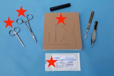 suture, needle driver, skin pad 