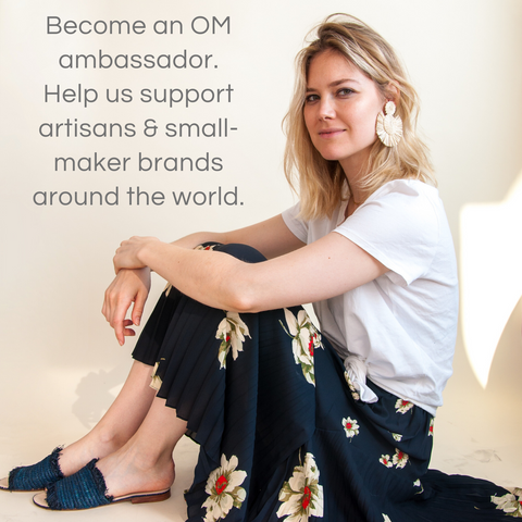 A woman sitting on a floor and a text on banner,
Become an OM ambassador, Help us support artisans and small-maker brands around the world.