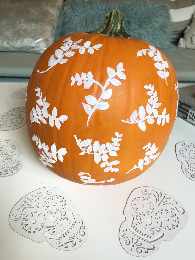 painted halloween pumpkin with leaf pattern