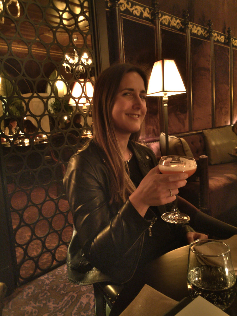 nomad hotel la girl with cocktail in lobby bar