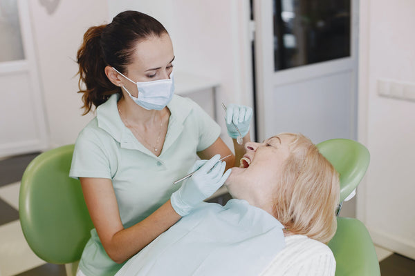 Dental assistant using equipment that has gone through steam sterilization