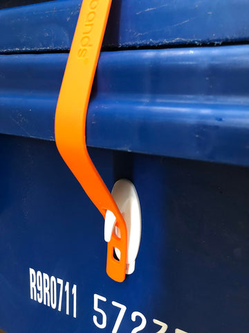 Packbands used to secure trashcan lid to keep out raccoons and possums