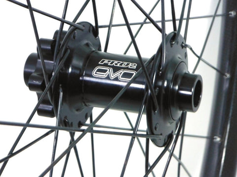 Photo of Light Bicycle Carbon MTB rims built onto Hope Evo and Tune Kong hubs by XLR8 wheels. Shows front hub.