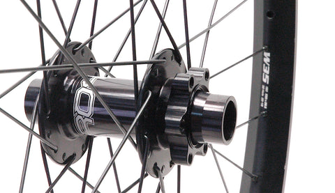 Hope MTB hubs rebuilt onto Syntace W35 wide alloy rims, by XLR8 Performance Bicycle Wheels. Front hub and rim shown.
