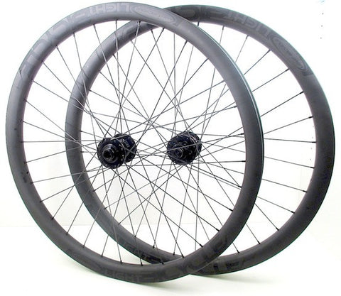 Picture of custom carbon wide enduro wheelset using Hope Pro4 on Light Bicycle MTB rims. Pair shown.