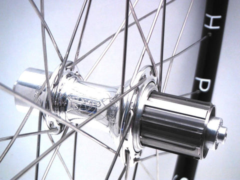 Photo of XLR8 custom cyclocross alloy wheels using Hplusson Archetype on White Industries T11 hubs. Rear shown.