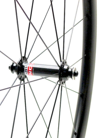 Nextie NXT45RT tubular carbon road rims laced onto Powertap Pro and Novatec hubs by XLR8 Performance Bicycle Wheels - side view