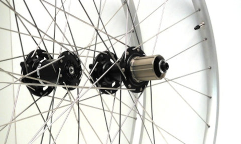 XLR8 wheels custom handmade 26 inch tubeless MTB wheels using XLR8 rear disc hub and a Cannondale Lefty front hub. Photo of hubs.