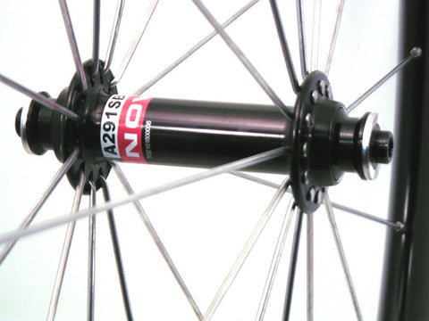 Photo of handmade custom alloy road, cyclocross, or gravel wheelset using Novatec A291SB hub on Kinlin XC279 rims. Front hub shown.