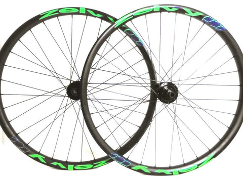 Image of custom MTB wheels hand build by XLR8 wheels - Project321 hubs on Zelvy Carbon rims with Sapim Spokes. Picture shoes the wheels with custom decals.