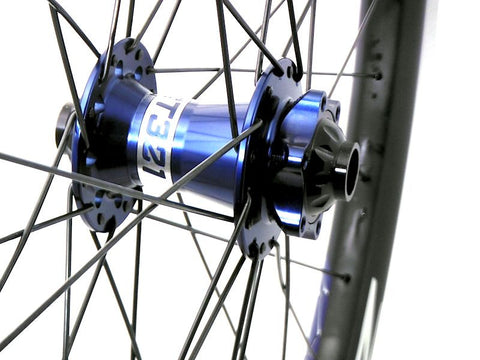 Photo of custom carbon MTB wheels using Project 321 hubs on Zelvy Carbon rims. Front hub pictured.