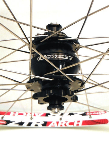 Photo of Shutter Precision PD8 dynamo hubs built onto Stan's No Tubes ARCH MTB rims, by XLR8 Wheels.