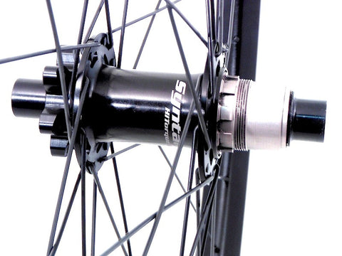 Picture of Syntace W35 wheels rebuilt by XLR8 wheels for better lateral stiffness. Rear hub pictured.