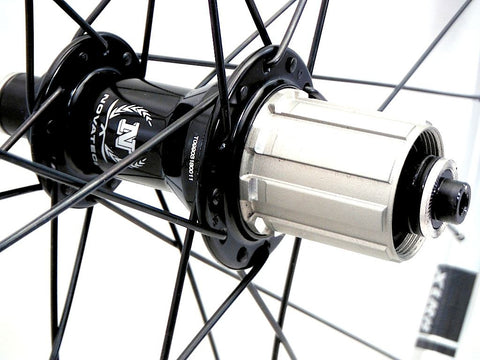 Photo of custom folding bicycle wheel using Velocity Aerohead IS520 rims and Novatec Hubs. Rear hub shown.