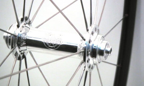 Image of White Industries T11 hubs on XLR8 rims custom alloy super light road bicycle wheels. Front hub shown.