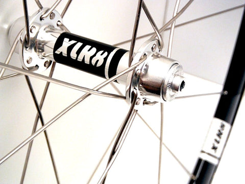 XLR8 wheels custom handmade hybrid carbon alloy road bike wheels using XLR8 MD hubs and Alexrims 40mm deep rims. Photo of front hub.