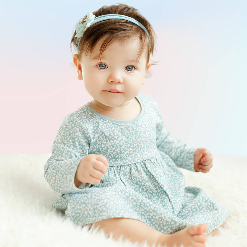 baby girl wearing spring dress with headband