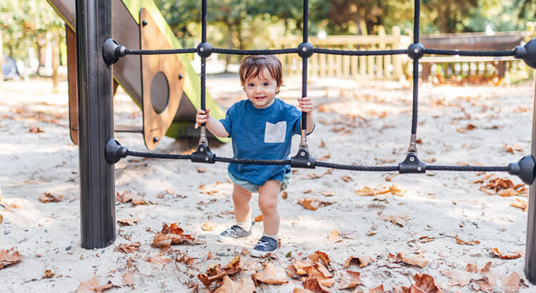 cute toddler boy playing outside