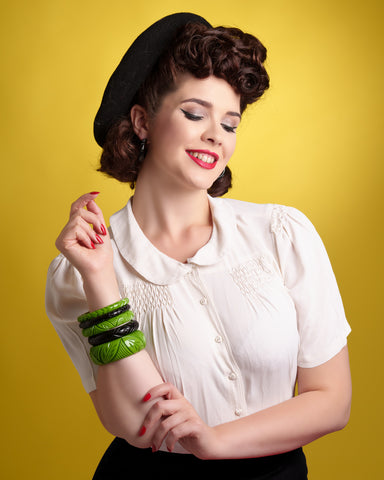 Splendette vintage inspired 1940s Bakelite style green Palm and Black Heavy Carve Fakelite jewellery worn by pin up model