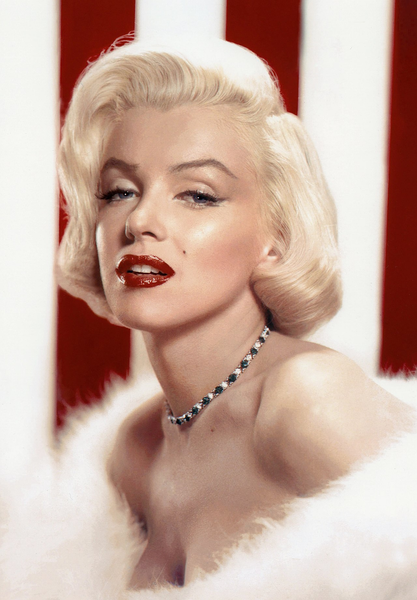 portrait of marilyn monroe wearing red lipstick, a necklace, and a white fur stole. she is in front of a red and white striped background.