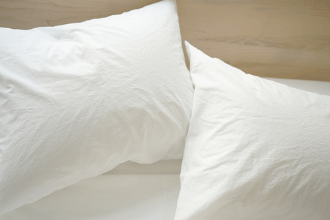 White Area ANTON percale sheets on pillow cases close up.