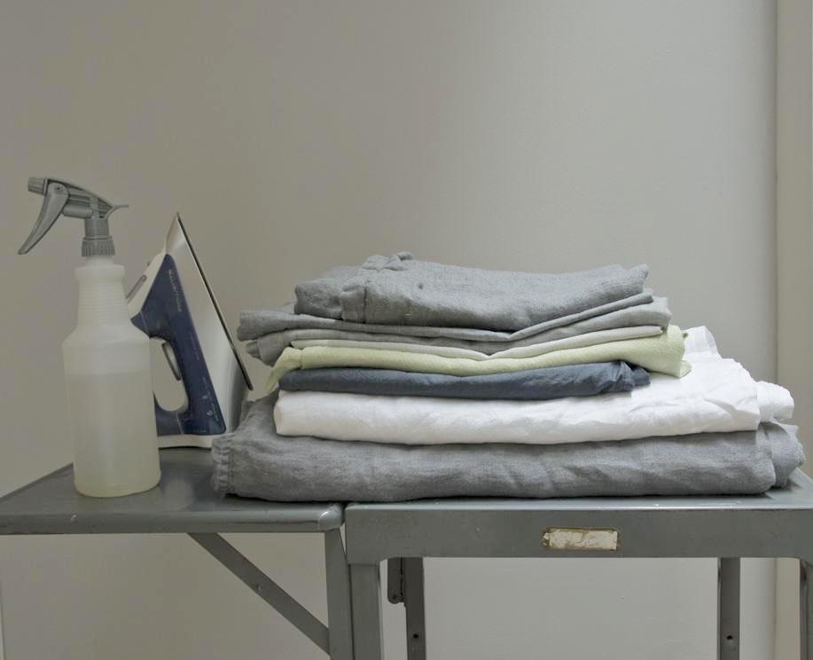 how to care for your linens ironing stack