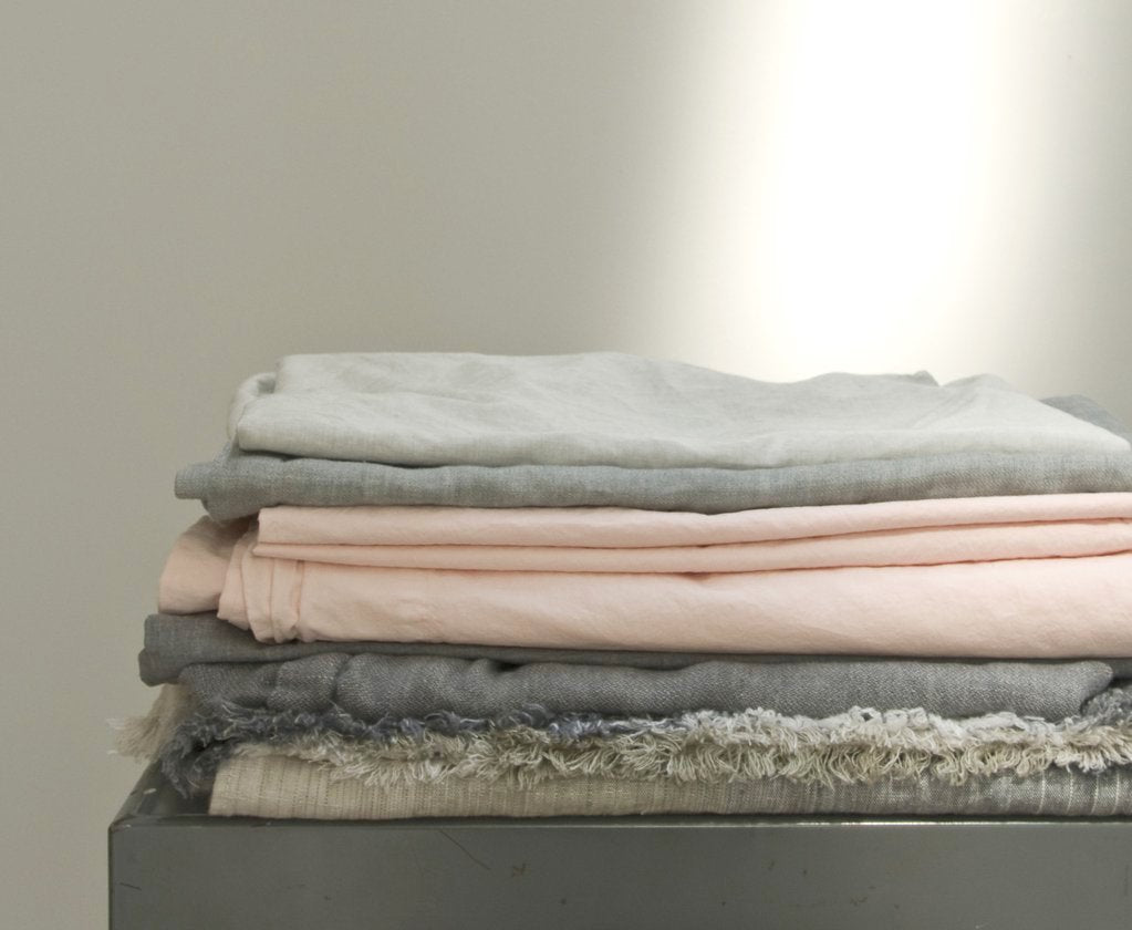 how to care for your linens stack of linens