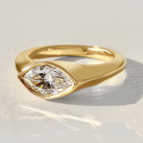 Aether Air Lab Diamond ethical sustainable engagement ring with signet ring and east west bezel set marquise diamond