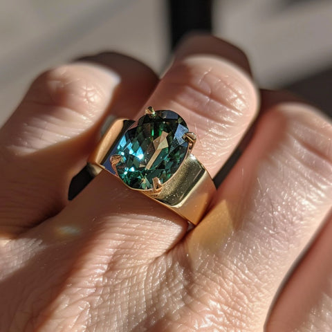 Alternative non-traditional Engagement Ring oval cut teal sapphire and wide cigar band