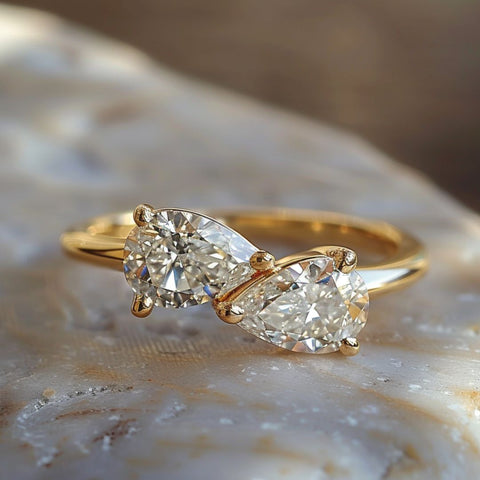 Alternative non-traditional Engagement Ring tot et moi style with pear cut diamonds