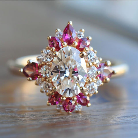Alternative non-traditional Engagement Ring with oval cut diamond and red pink ruby morganite halo