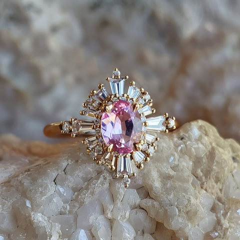 Alternative non traditional engagement ring celestial oval cut pink sapphire baguette halo