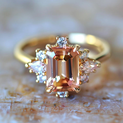 alternative non traditional engagement ring celestial emerald cut peach sapphire diamond pear halo