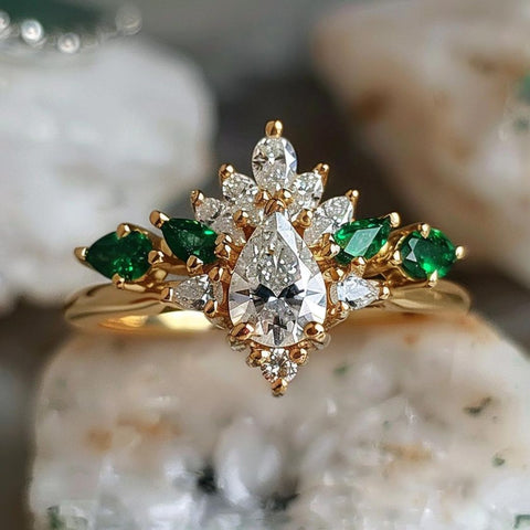 witchy engagement ring the green witch with pear cut diamond and pear cut green emerald halo