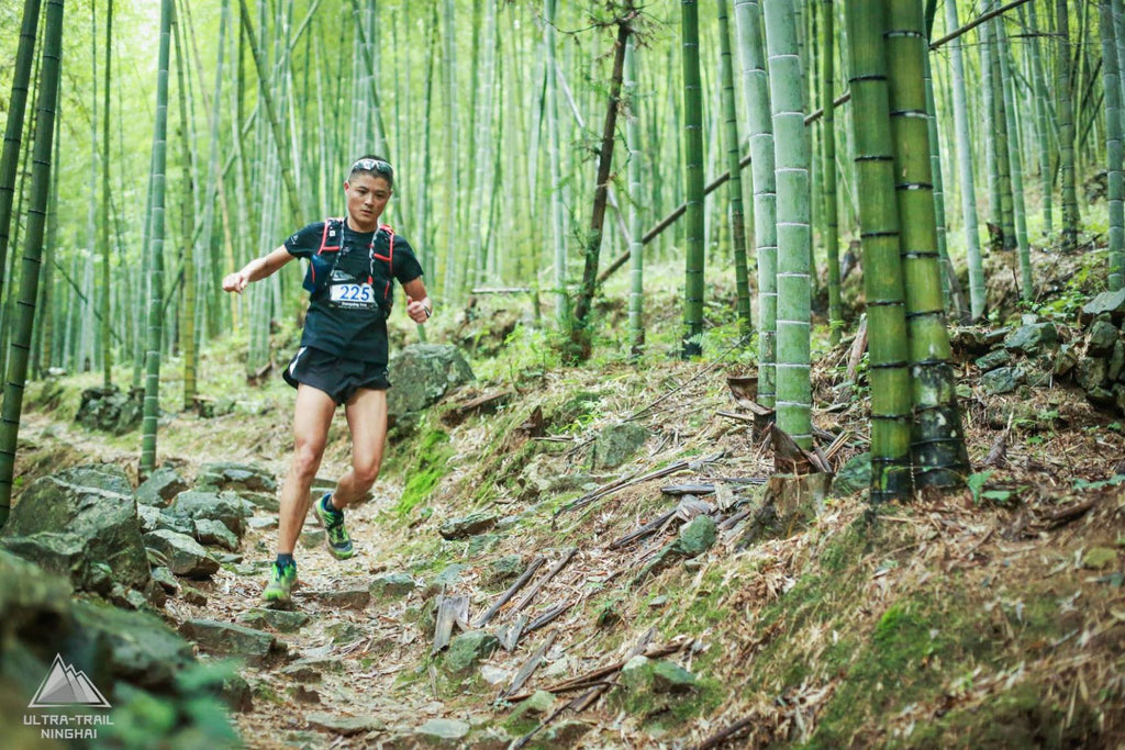 Trail runner in a bamboo forest in Ninghai, China