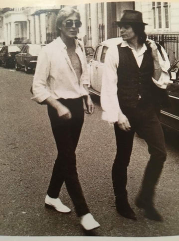 Mick Ronson and Mick Rossi walking down the street together