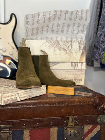 A pair of Women's Olive Suede Original Chelsea Boots with our Bamboo Brush