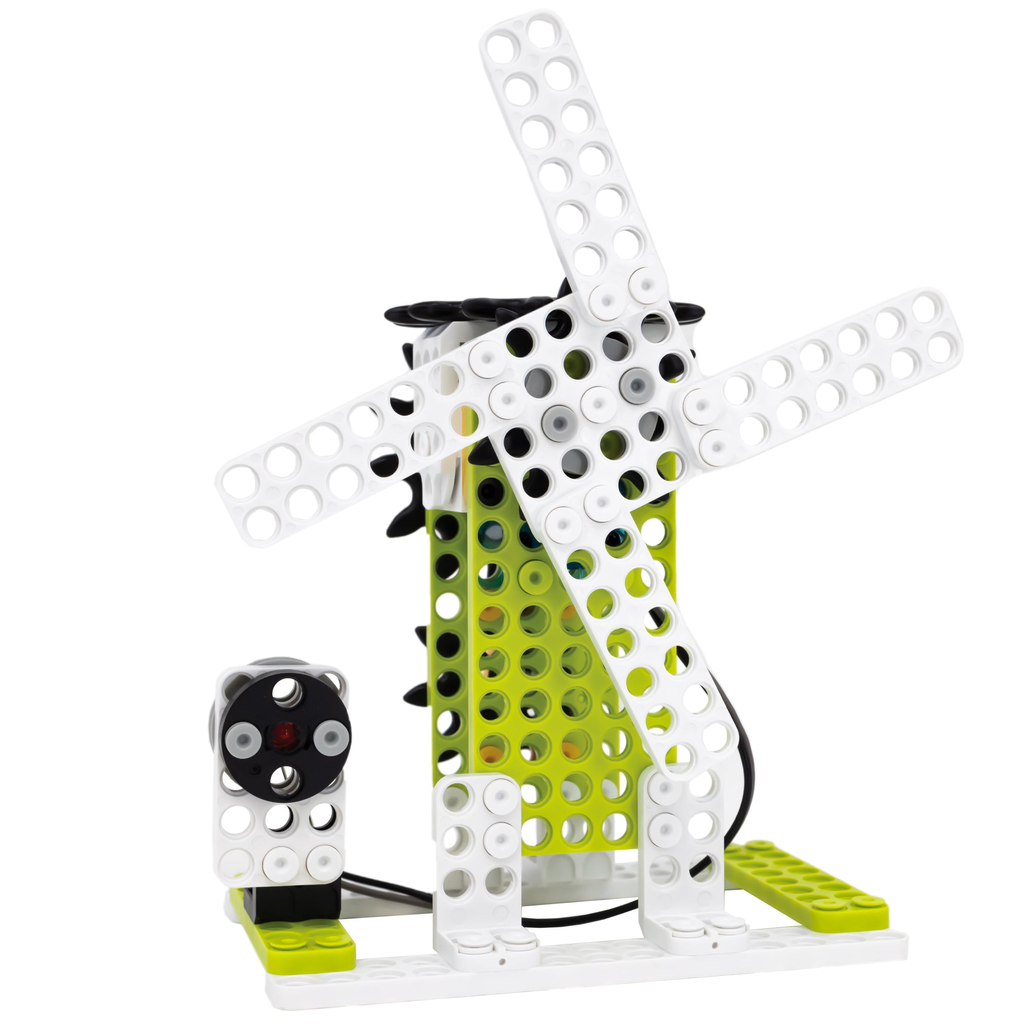 Robotis Dream 2 windmill figure attached to a light and and crank motor. The windmill body is bright green with white blades. On the left is a white piece with a black circle and a red light in the middle of it. Each piece has holes throughout in a grid pattern to put securing pegs into,