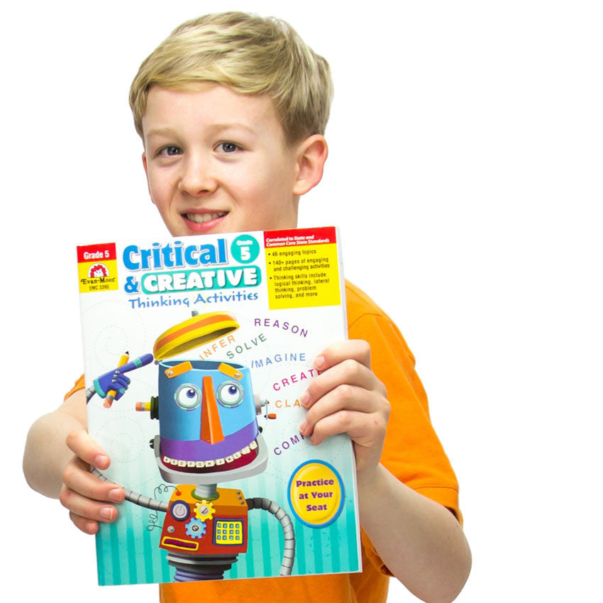 A young blonde boy wearing a bright orange shirt and holding up the Critical & Creative Thinking book 5 in front of him. The background of the book is white at the top and turns to teal stripes at the bottom. The title is at the top and in the middle is a colorful robot pointing his right hand at his head. Colorful words are spilling out of the top of his open head. The words are Infer, solver, reason, imagine, create, classify, and compare.